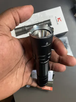 Klarus XT11R Tactical Flashlight, 1300 Lumens, 300m Beam, IPX8 actual product photo.
