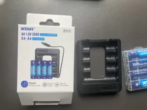 XTAR C4-AA USB-C Charger Bundle with 4pcs × 1.5V 2500mAh Lithium AA Batteries actual product photo.