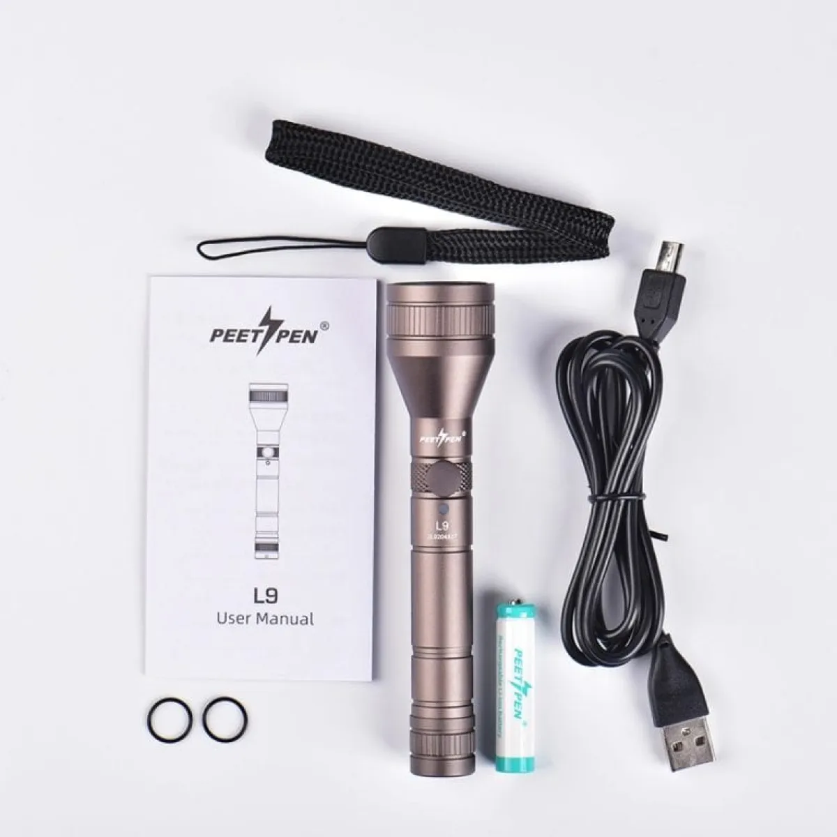 PEETPEN L9 mini flashlight, with keys for scale